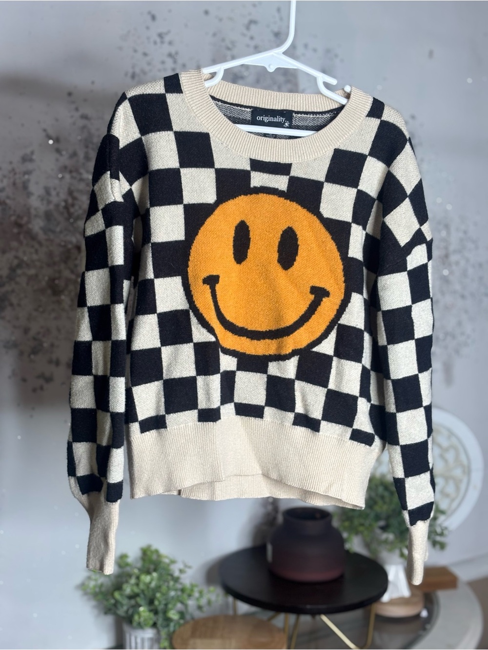 Black & Cream Checkerboard Sweater with Orange Smile